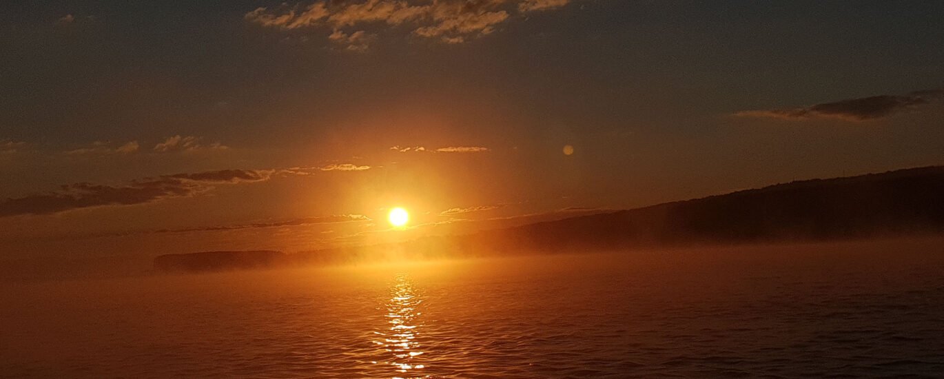 sunrise above Danube river with clouds