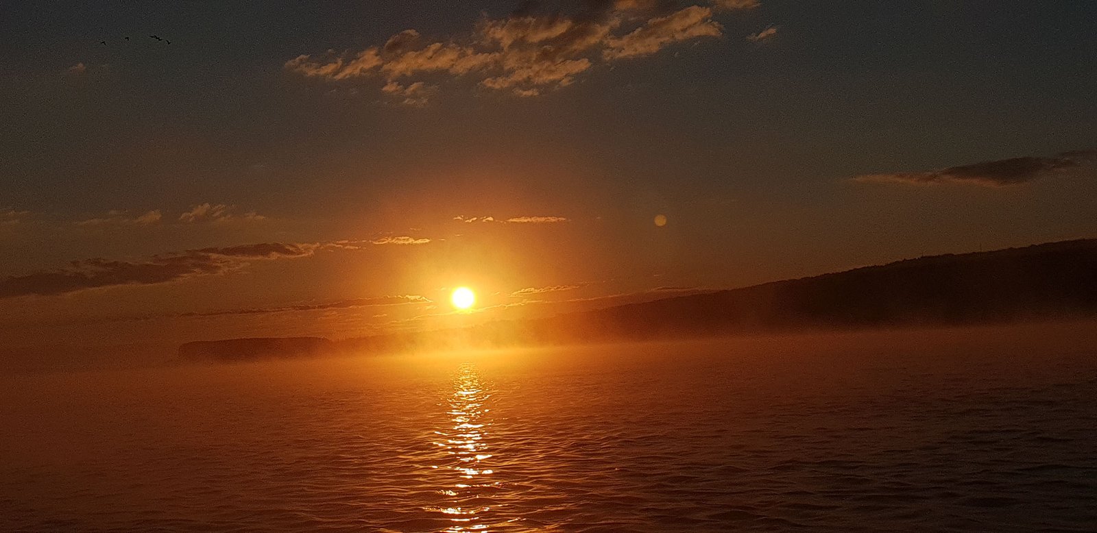 sunrise above Danube river with clouds